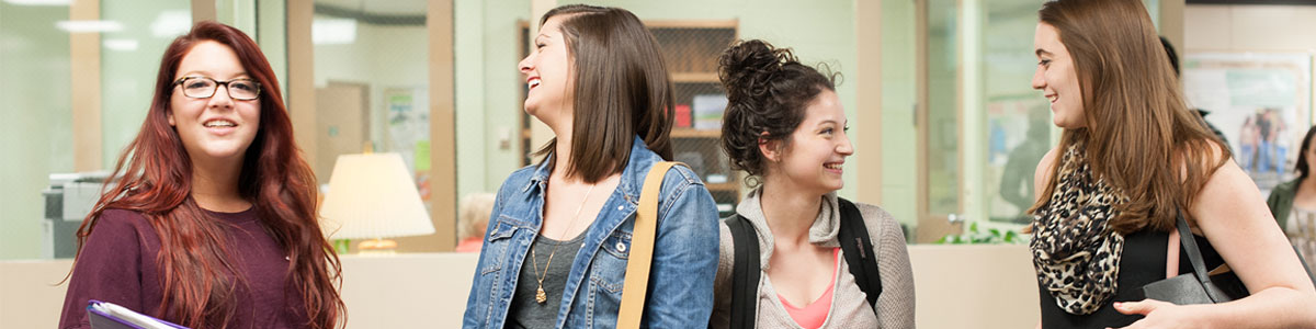 four smiling students