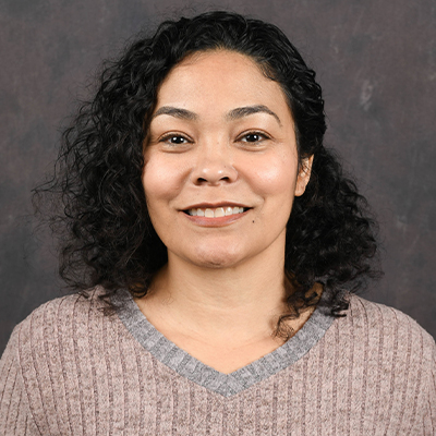 Profile photo of Aisha Chun, a Director of Data Strategy and Institutional Analytics, in front of a professional backdrop.