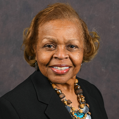 Profile photo of Helen Bond, aFinancial Aid Assistant and Customer Service Specialist, in front of a professional backdrop.