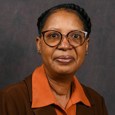 Profile photo of Pamela McCord, student support specialist, in front of a professional backdrop.