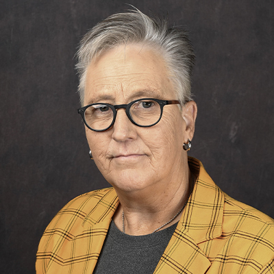 Profile photo of Sharon Grigsby, assistant professor of psychology, in front of a professional backdrop.