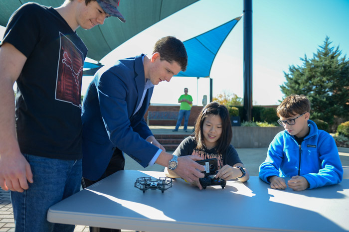 2023 STEM Within Reach attendees learn to operate remote-controlled drones. 