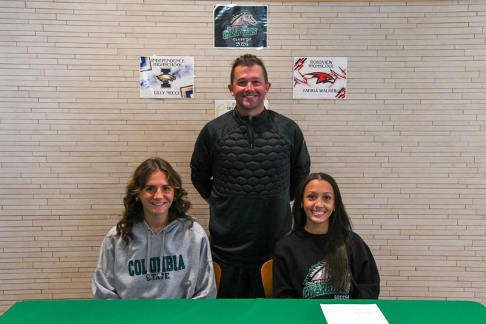 Pictured (standing): Kean Barclay, Columbia State women’s soccer head coach, with the first of the recruits for the 2026 season (sitting, left to right): Lily Necci and Zaharia Walker.