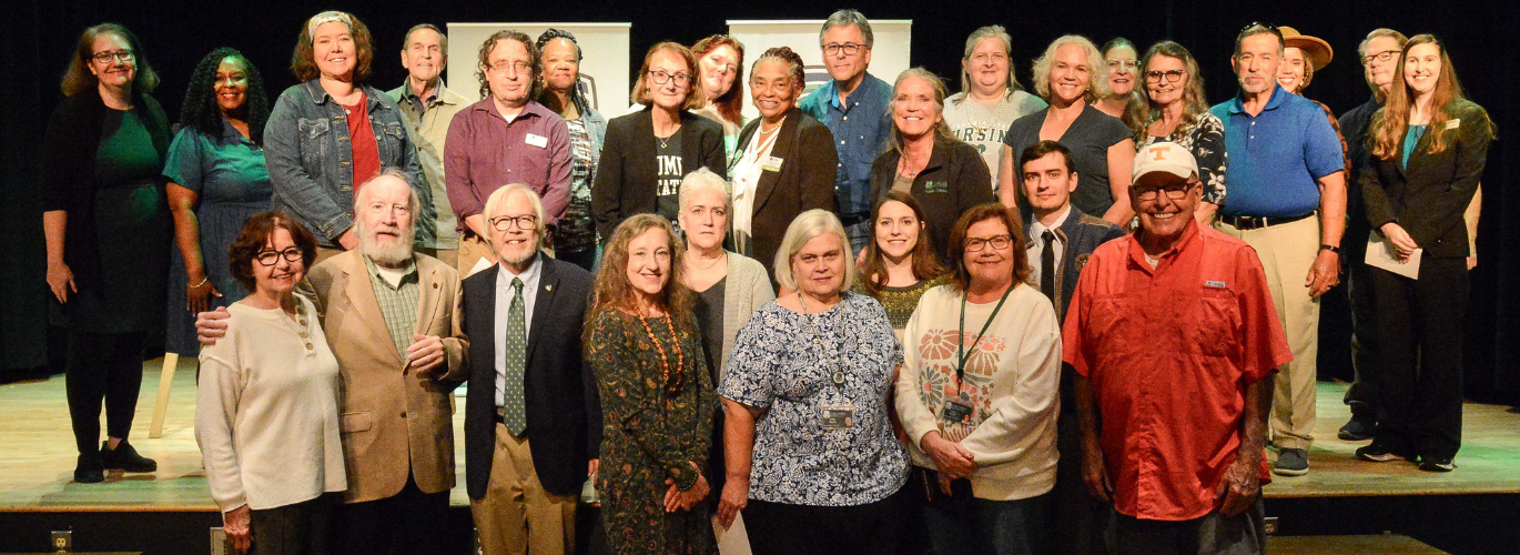 Dr. James Senefeld (bottom row, second from the left) is joined by current and retired Columbia State faculty and staff.
