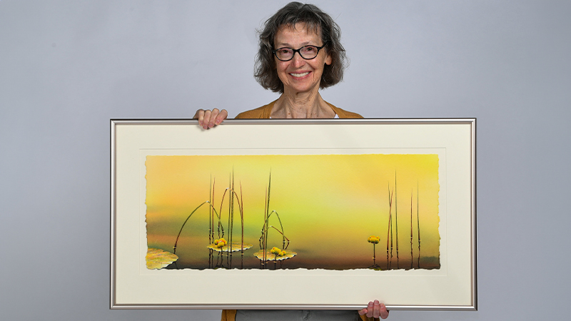 Linda Koenig and her painting “The Shallows.”