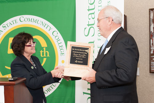 Dr. Smith presents award to Dr. Beck